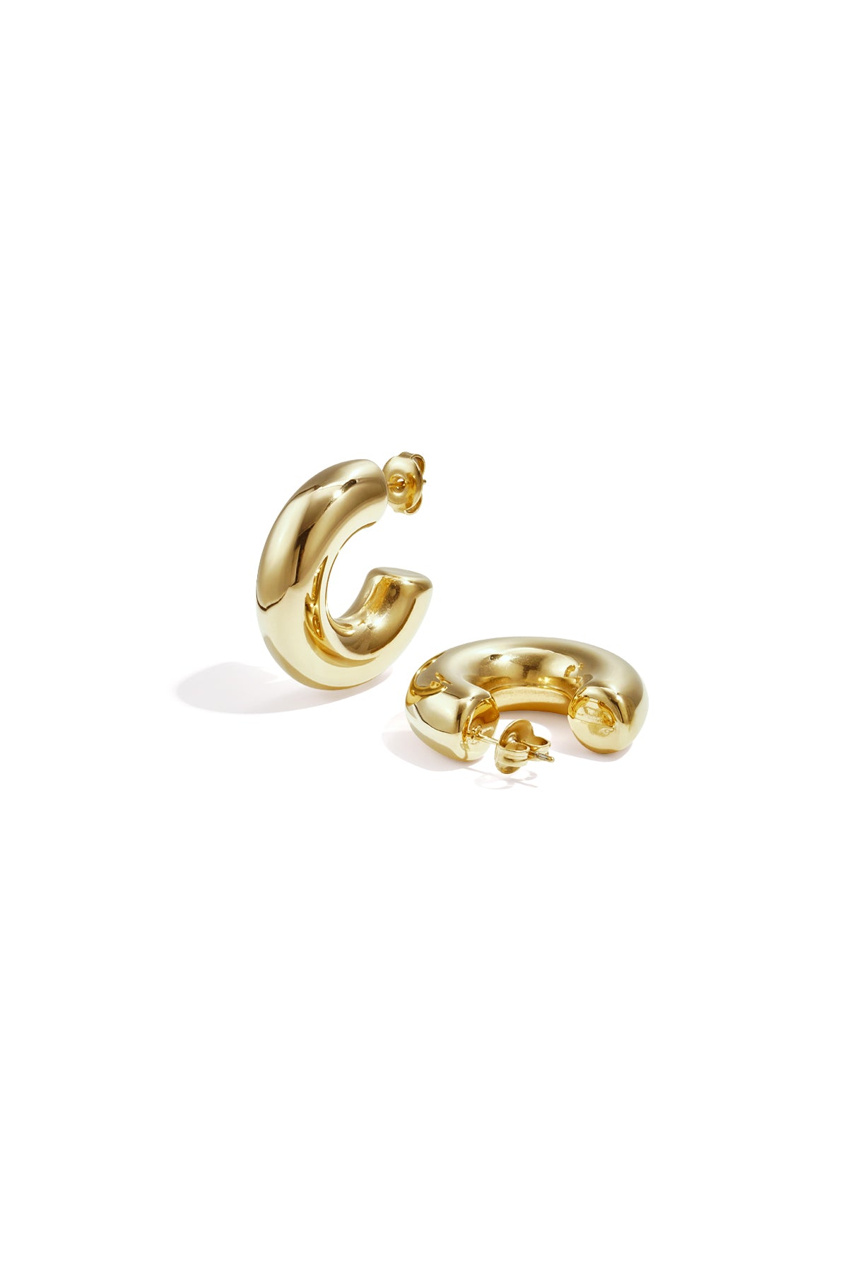 Pair of chunky gold hoop earrings with smooth polished finish displayed on white background