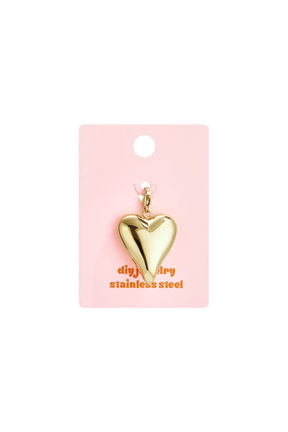 Glossy gold heart charm on a pink display card, crafted from stainless steel with a sleek, rounded statement design.