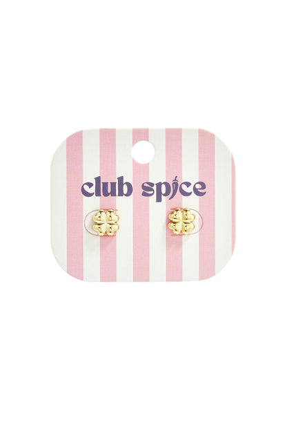 Gold four-leaf clover stud earrings displayed on pink and white striped card with Club Spice logo