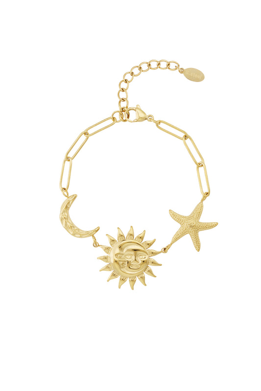 Gold celestial charm bracelet featuring textured sun with face, crescent moon, and star charms on a chain link bracelet