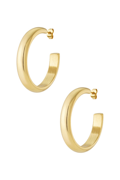 Pair of polished gold chunky hoop earrings with smooth rounded design and post fasteners