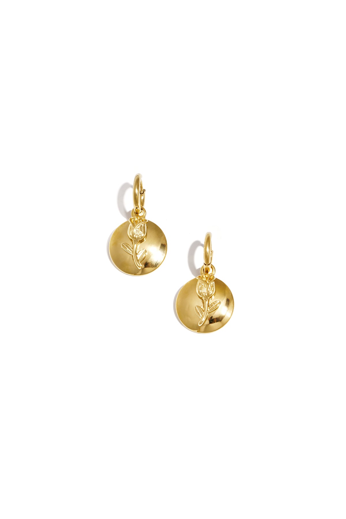 Pair of gold-tone drop earrings with a textured rose on a circular disc, shown against white background