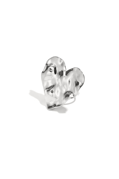 Silver textured heart statement ring close-up on white background