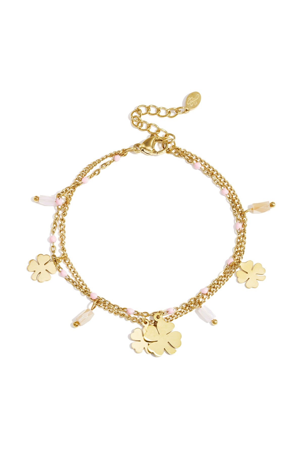 Gold-tone double chain charm bracelet adorned with pink beads and four-leaf clover pendants laid flat