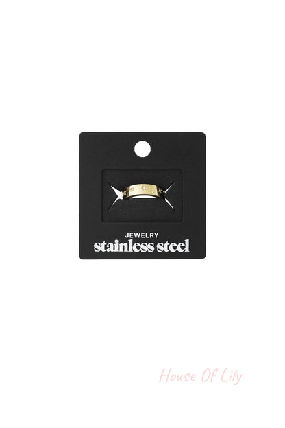 Little Stargazer Ring: A gold-tone stainless steel band featuring delicate cutout star motifs, displayed on a card.