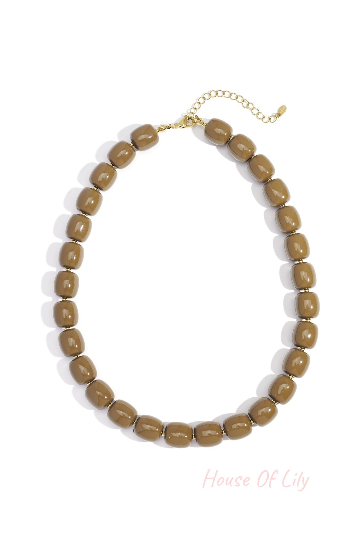 Close-up of coffee brown chunky acrylic bead necklace with gold-tone chain extension on white background