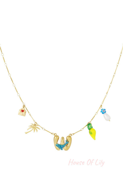 Gold chain necklace with 'W' initial pendant and colorful charms including a palm tree, envelope, lemon, and flower.