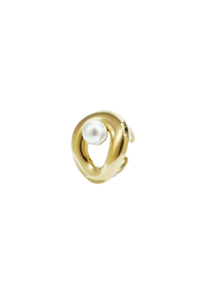 Close-up of a gold sculpted statement ring with a single white pearl on a white background