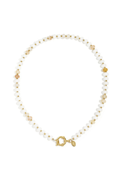 Beaded necklace with small, faceted white and amber stones separated by tiny gold beads and a gold circular clasp.