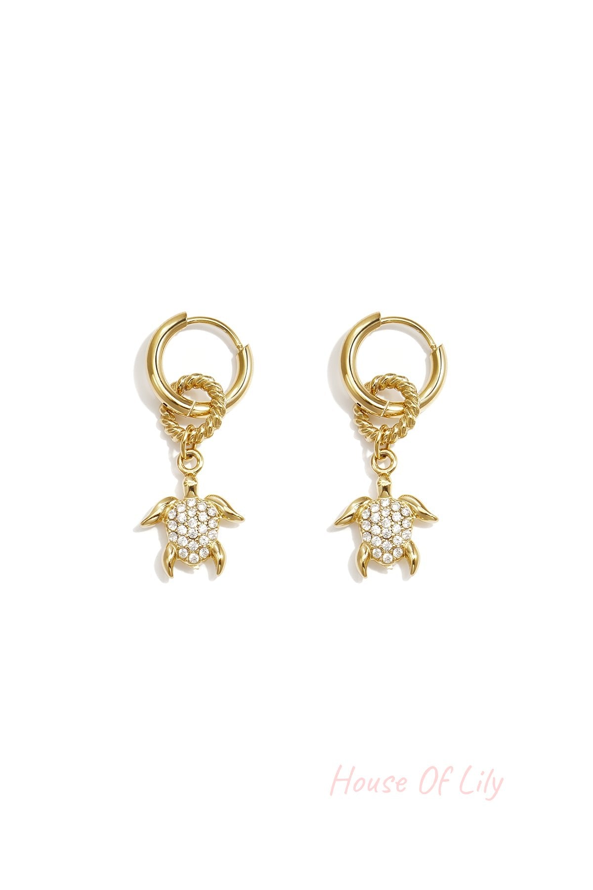 Gold hoop earrings featuring dangling turtle charms with pave crystal shells.