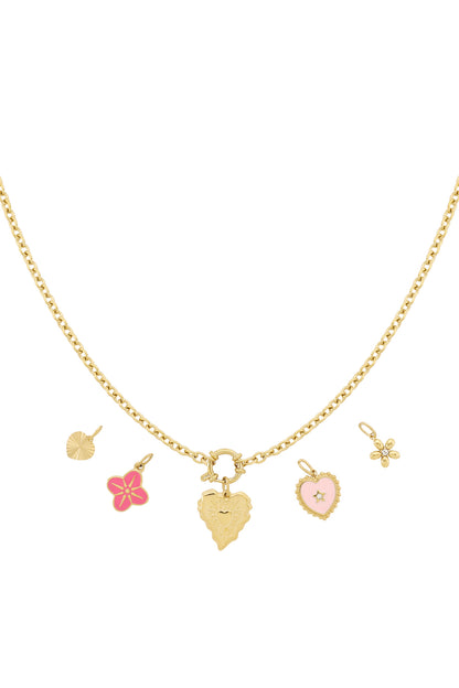 Gold chain necklace with interchangeable heart and flower charms in pink and gold enamel laid flat on white background