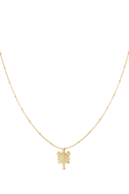Gold lobster pendant necklace with rhinestone accents on delicate gold chain against white background