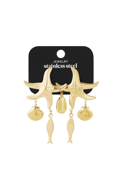 Gold-toned stainless steel starfish dangle earrings featuring hanging seashell and fish charms on a black display card.
