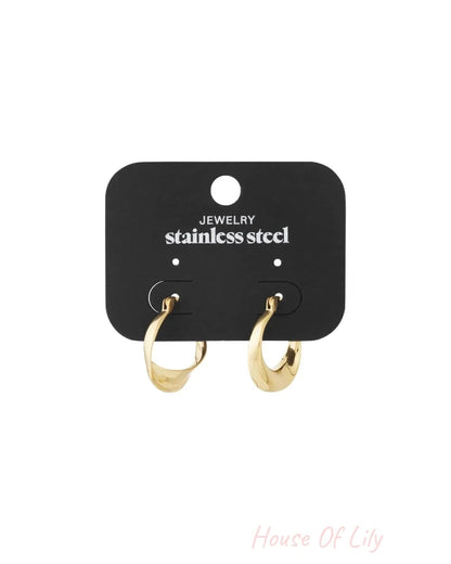 Gold-colored melted curve hoop earrings with a polished, organic twisted shape.