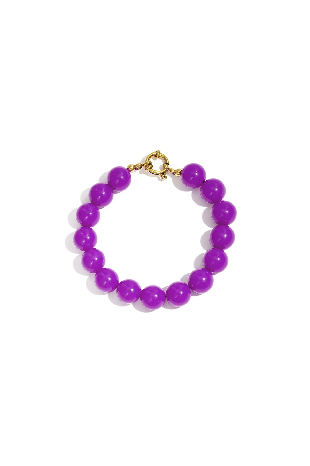 Bracelet of vibrant, glossy purple resin beads with a gold-tone circular clasp, isolated on a white background.