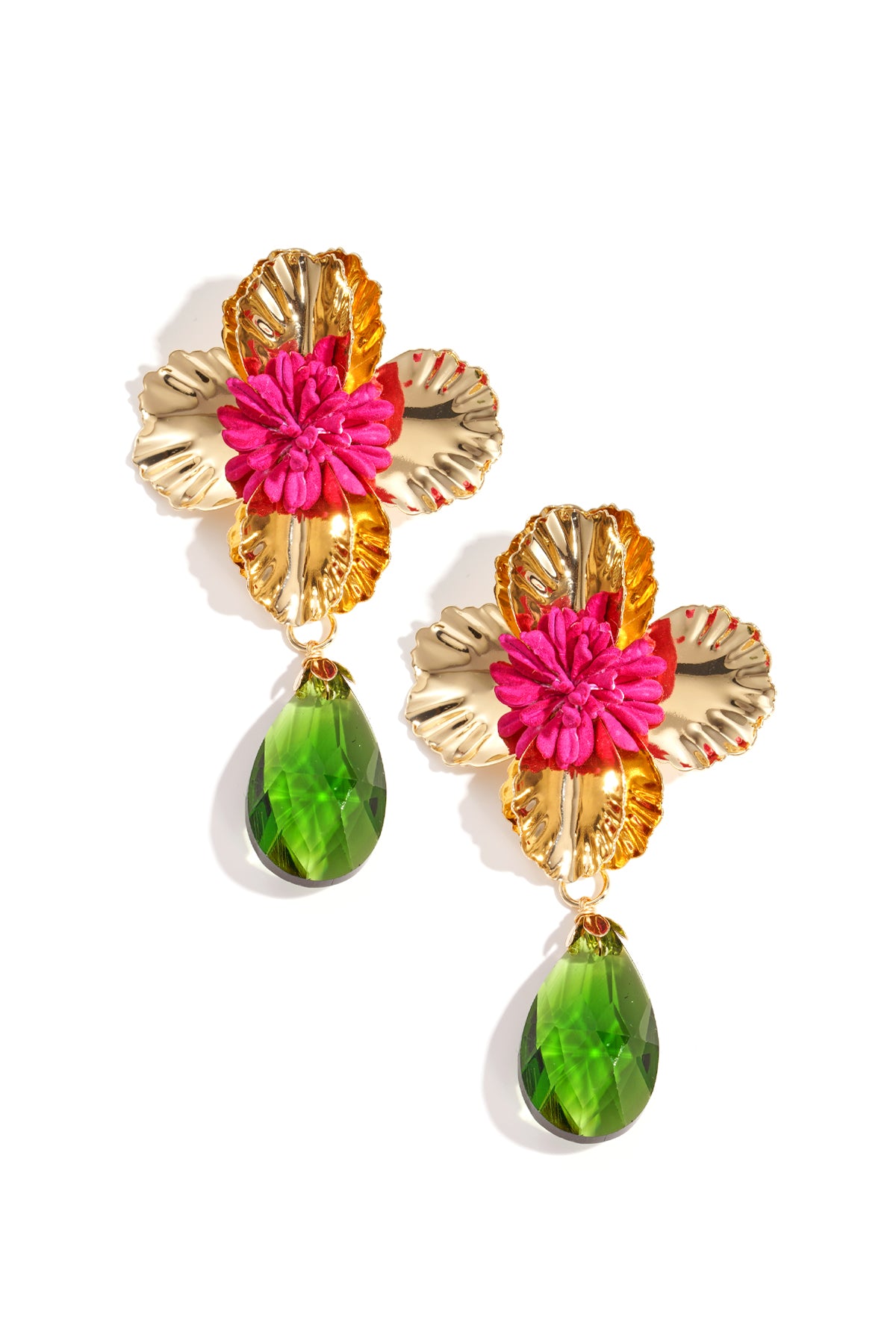 Pair of gold-toned floral drop earrings with bright pink fabric flower center and green faceted teardrop pendants on white background
