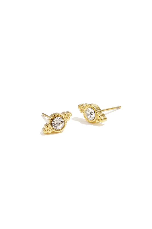 Pair of gold-toned crystal stud earrings with irregular shaped design on white background
