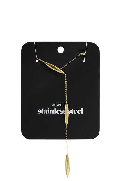 Gold Y2K drop necklace featuring thin chain and three polished, elongated teardrop pendants on a black display card.