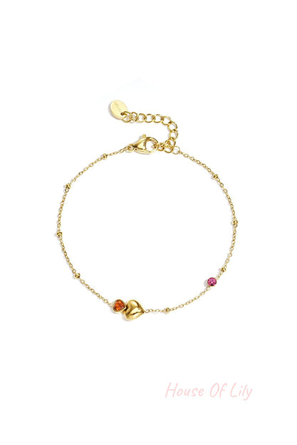 Bracelet with hearts, colored stones, and dots