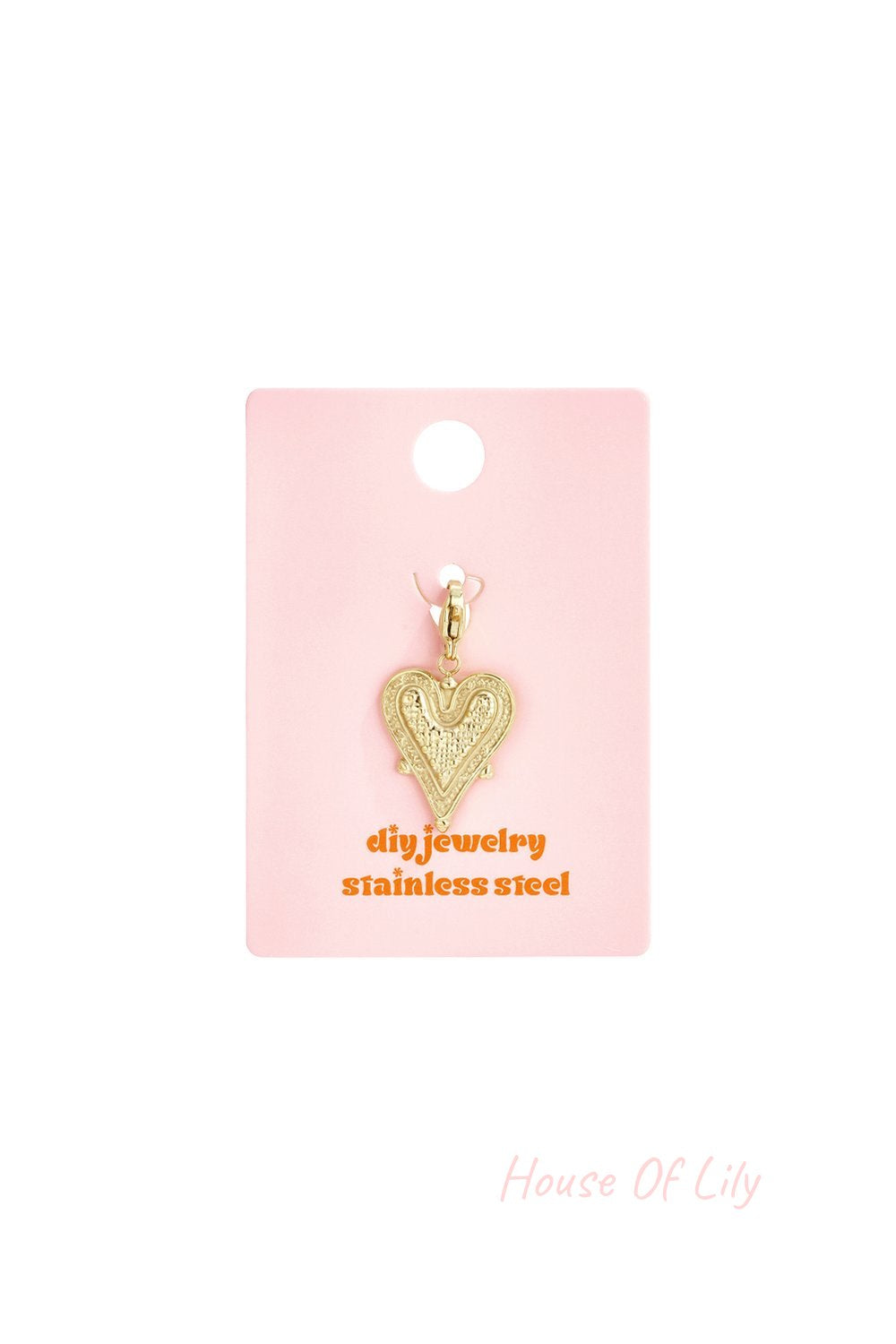 Gold heart charm with textured detail on a pink display card labeled "diy jewelry stainless steel."