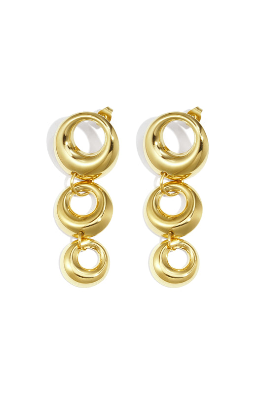 Pair of chunky linked circle dangle earrings in glossy gold tone on white background