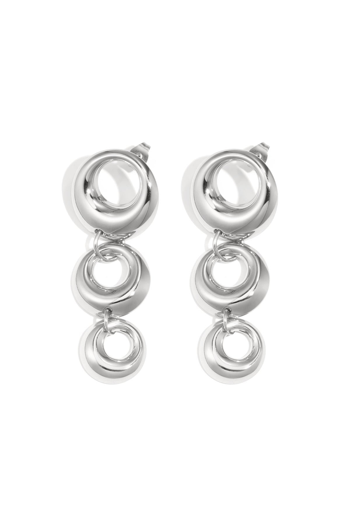 Pair of chunky linked circle dangle earrings in glossy silver tone on white background