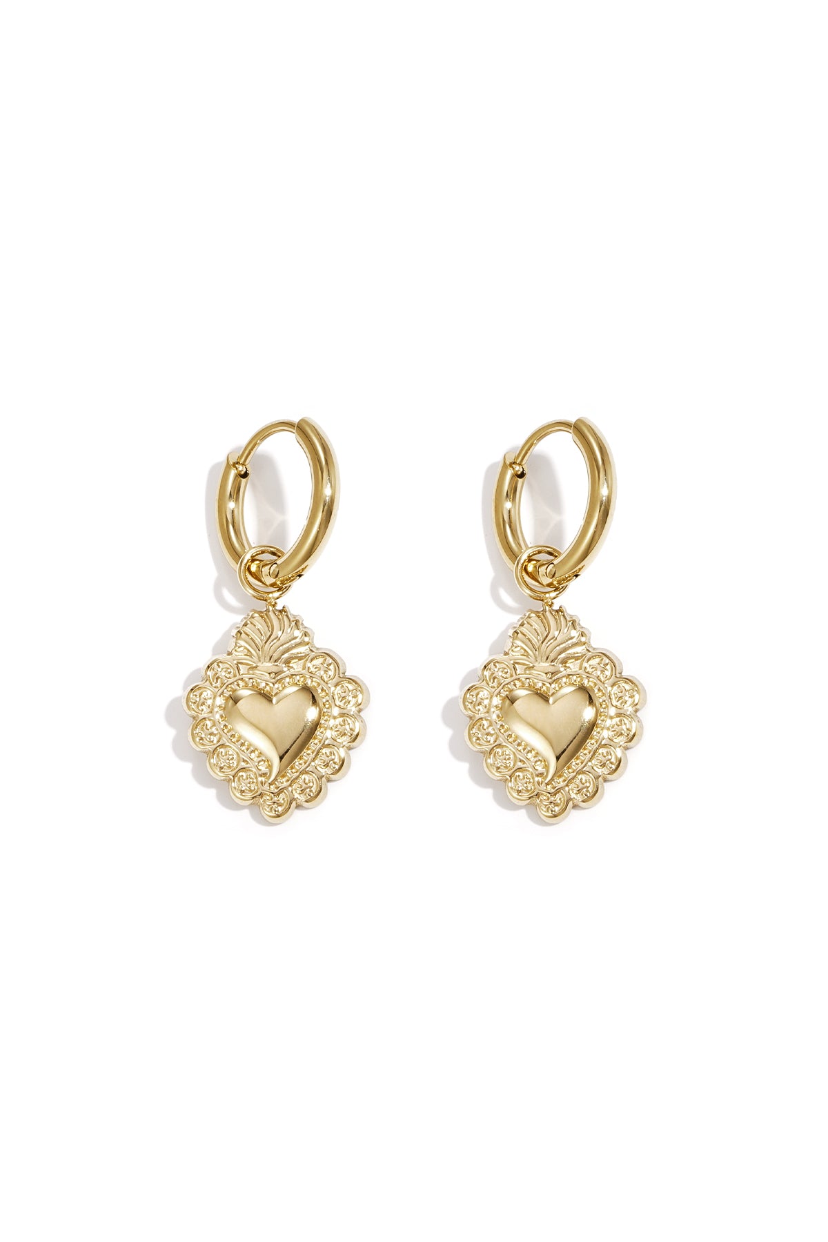 Pair of gold-toned hoop earrings with ornate heart-shaped pendants featuring embossed floral detailing