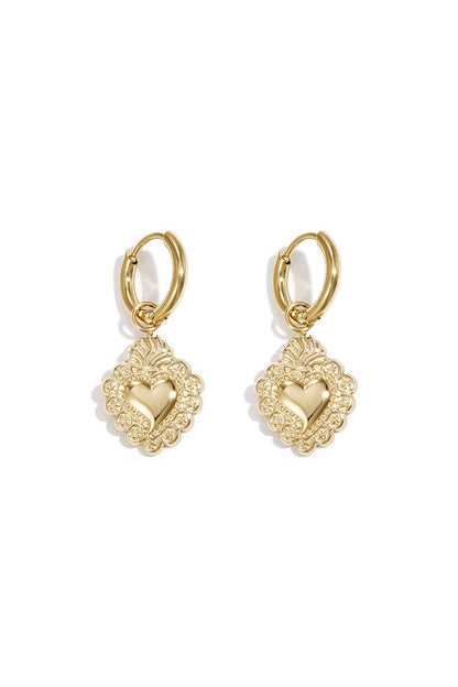 Pair of gold-toned hoop earrings with ornate heart-shaped pendants featuring embossed floral detailing