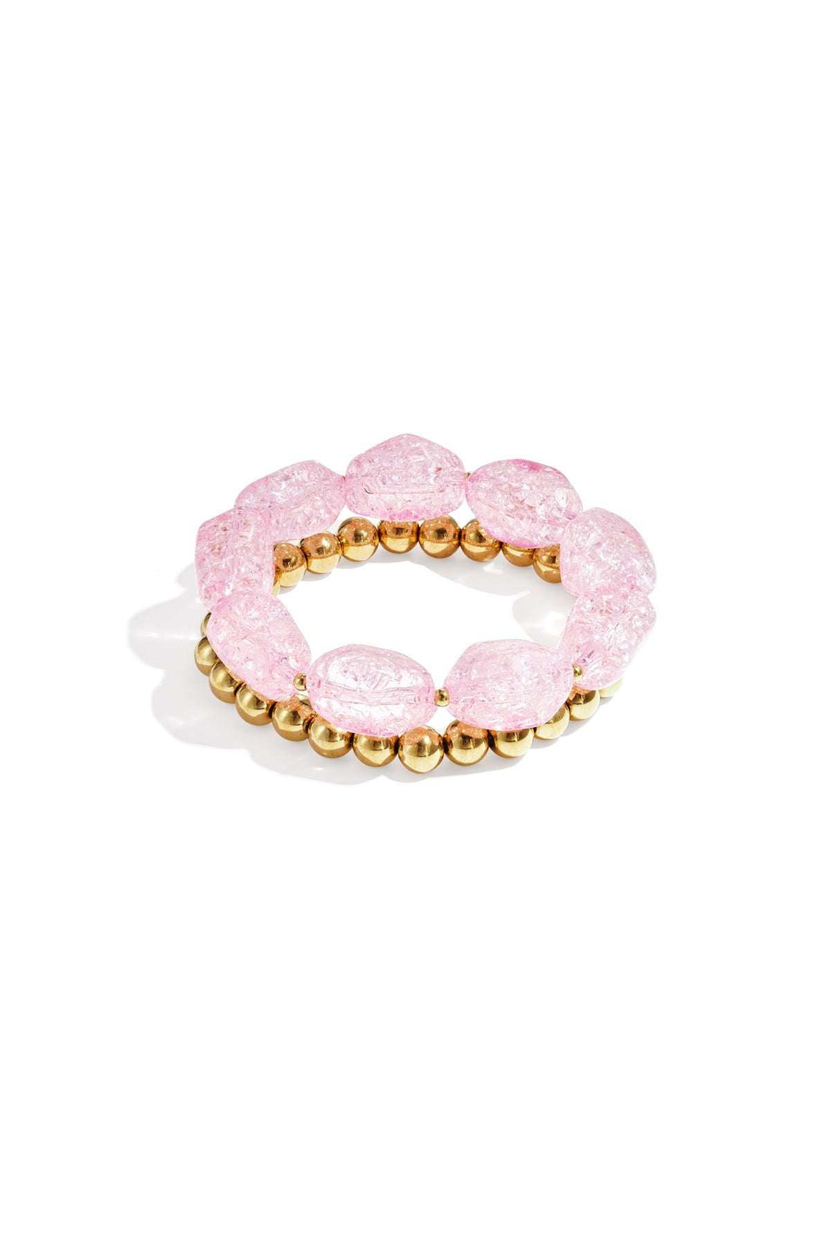 Light pink chunky beaded bracelet set with glossy acrylic and gold-tone metal beads displayed on white background