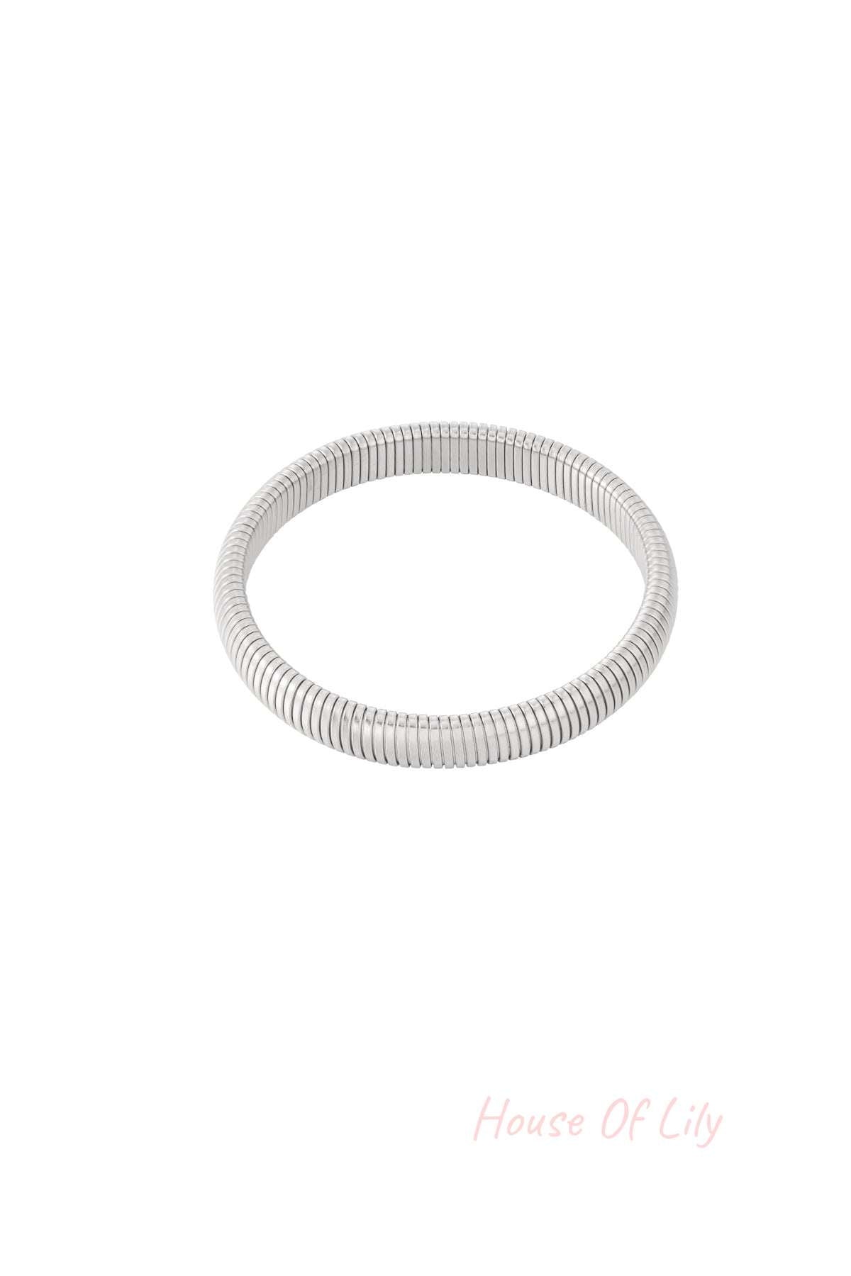 Alternate close-up of the silver stretch bracelet, emphasizing smooth texture and stretch fit on white background