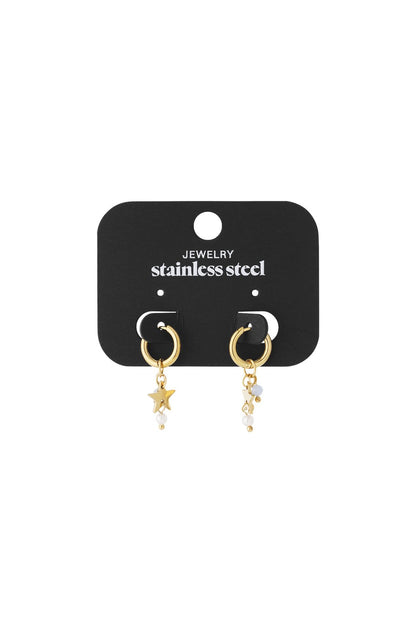 Gold stainless steel huggie hoop earrings featuring dangling star charms and small blush-pink beads on a display card.