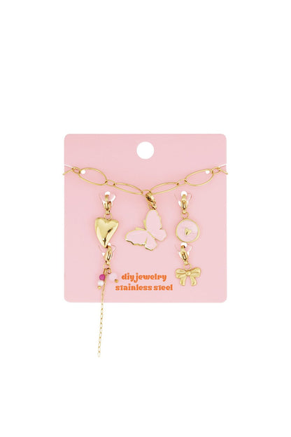 Elegant Gold Link Charm jewelry set featuring gold-toned butterfly, heart, bow, and bead charms on a pink card.