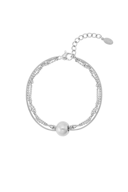Silver toned multi-chain bracelet featuring a smooth round sphere charm and adjustable lobster clasp closure on white background