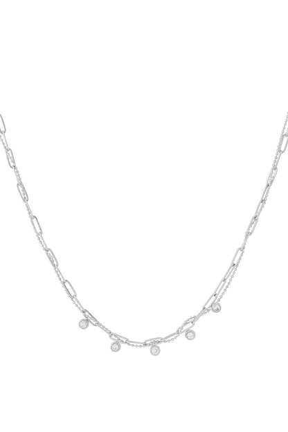Close-up of the same layered necklace design in polished silver with rectangular links and round gemstone charms on a white background.
