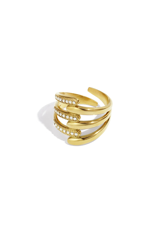 Gold-tone multi-band statement ring with rhinestone accents on white background