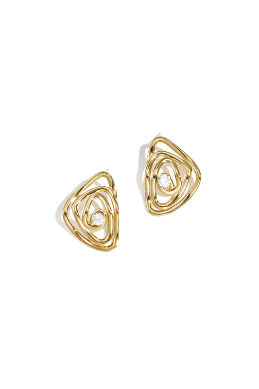 Pair of gold-tone spiral earrings with a central rhinestone on white background