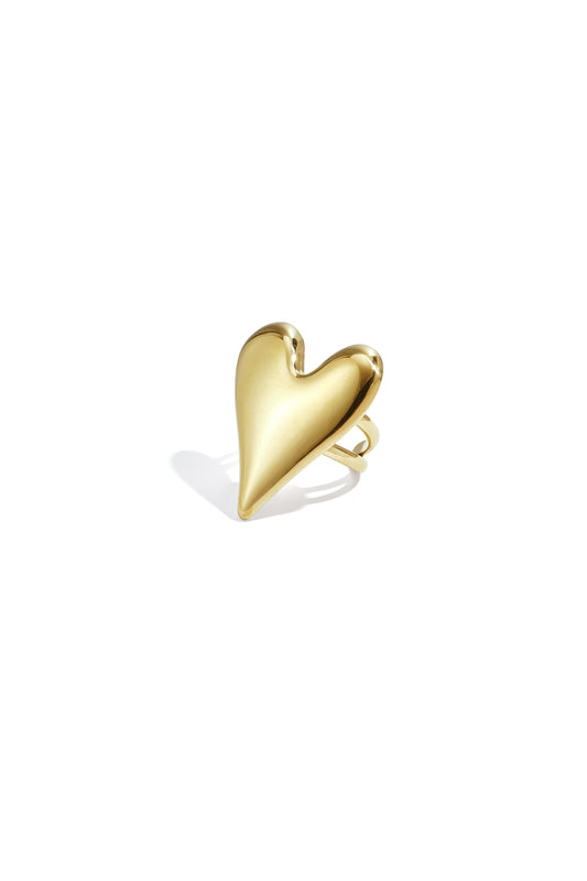 Polished gold-toned statement ring featuring a large puffed heart shape isolated on a white background