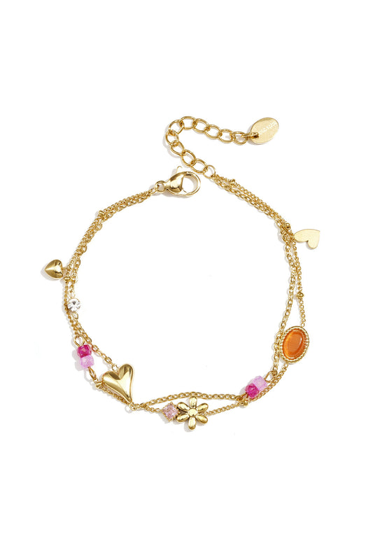 Double bracelet with varying pendants, beads, and stones