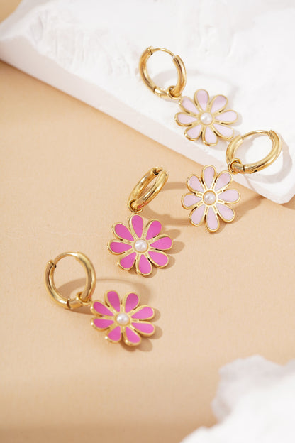Golden Bloom Hoops: Gold huggie earrings featuring pink and light pink enamel flower charms with pearl centers.