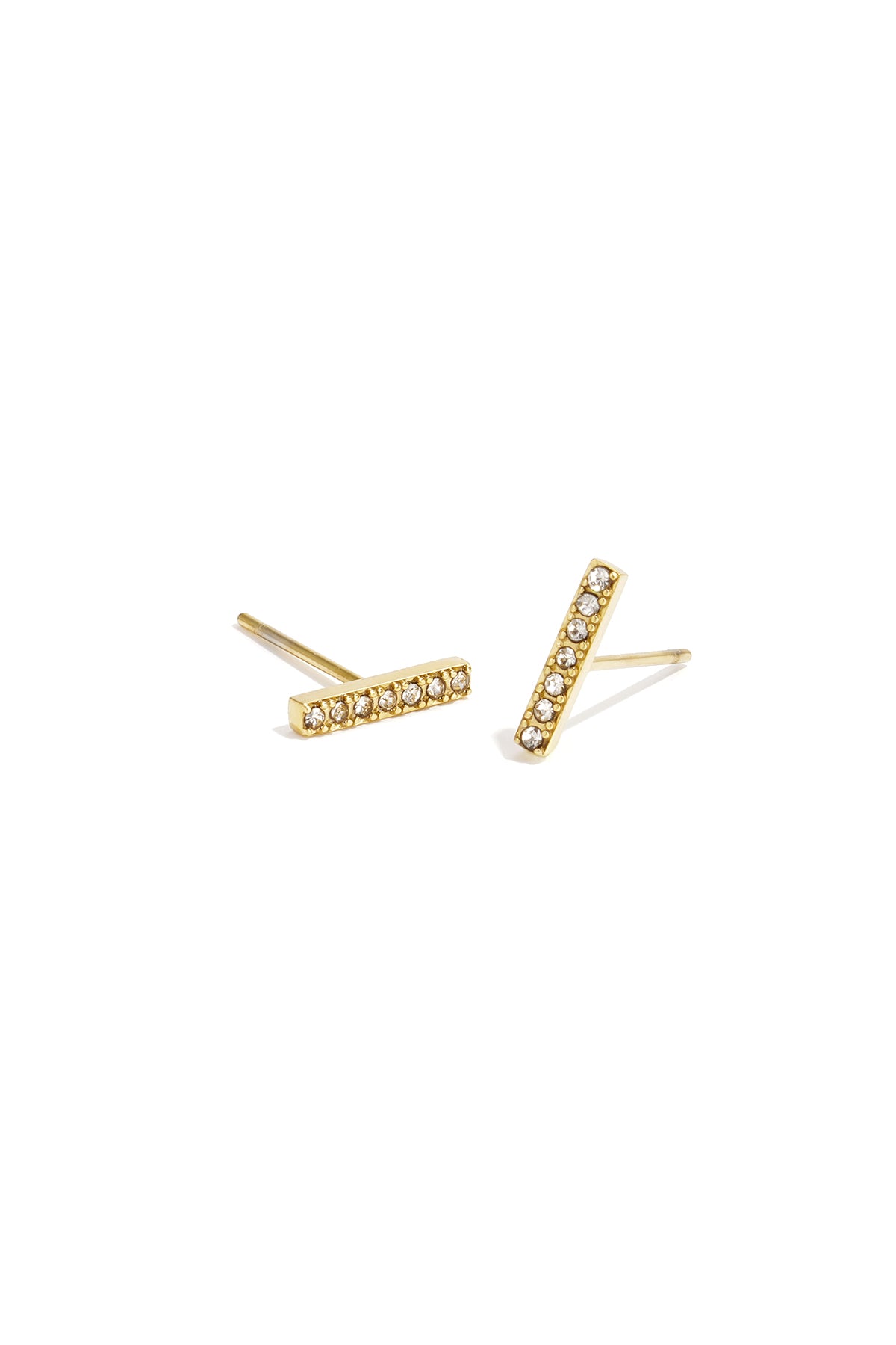 Gold-tone minimal bar stud earrings adorned with small rhinestones displayed on white background