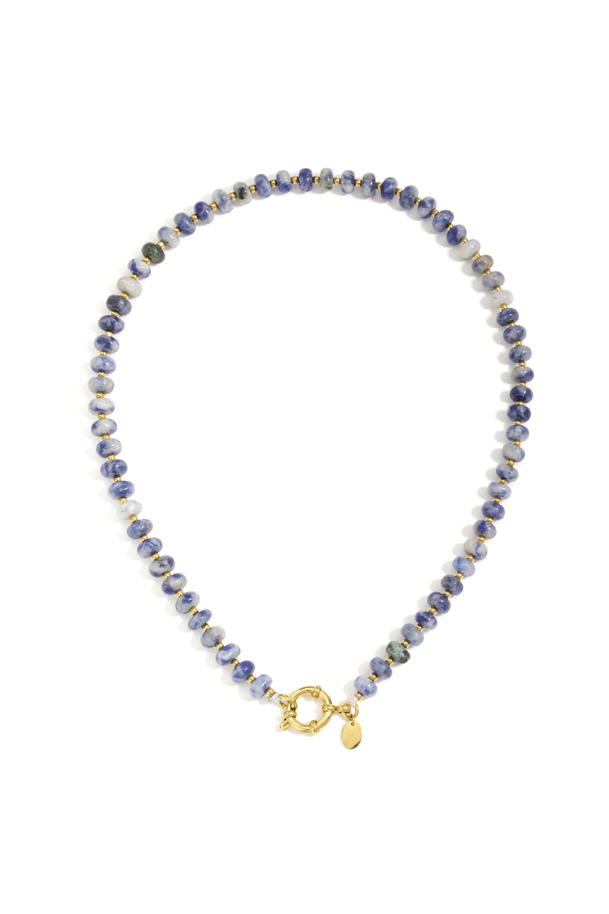 Close-up of a blue and white stone beaded necklace with small gold beads and toggle clasp