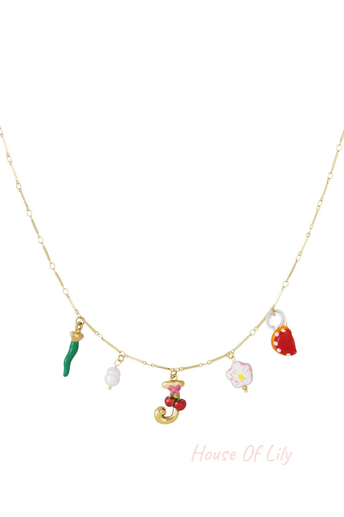 Gold chain necklace with a letter J charm, cherry motif, and colorful whimsical charms including a pepper and mushroom.