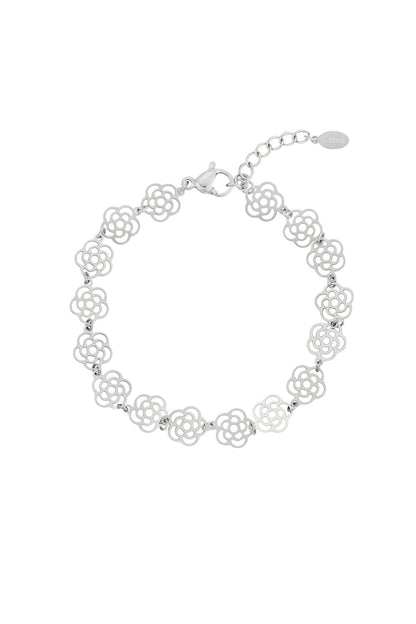 Silver tone delicate rose link bracelet with lobster clasp and adjustable chain on white background