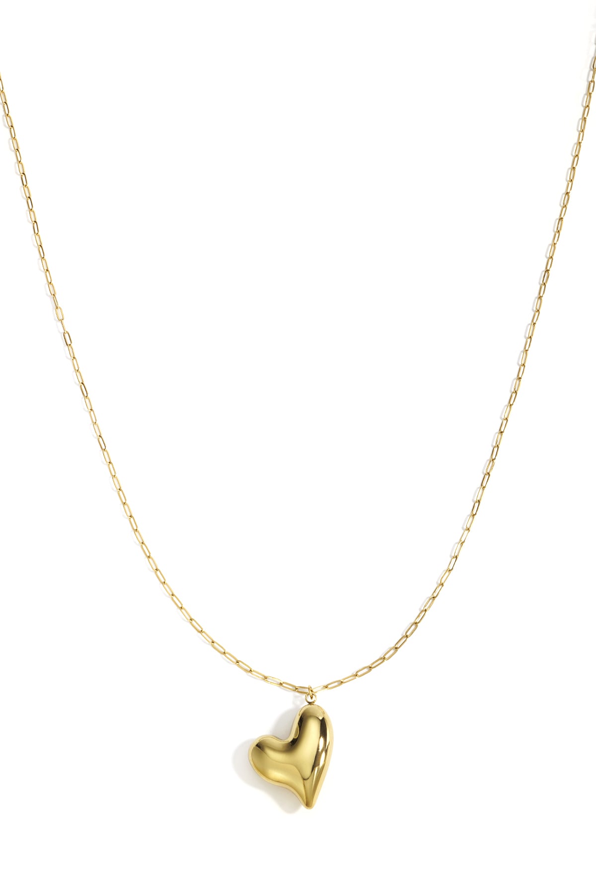 Gold chunky heart pendant necklace with minimal long chain on white background