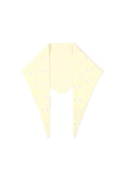 Soft knit triangle scarf in pale yellow with white polka dots, displayed flat on white background