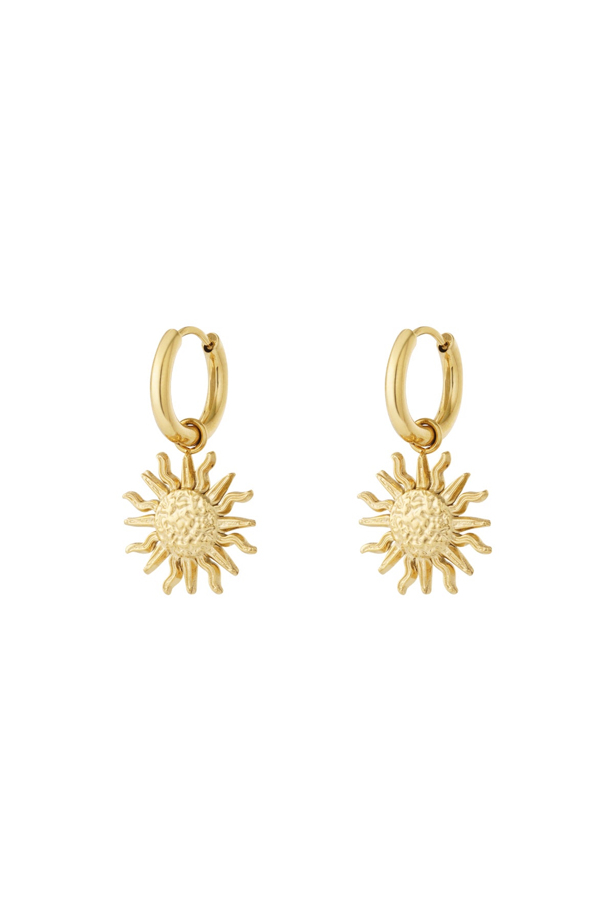 Pair of gold drop hoop earrings with textured sun charm pendants on white background