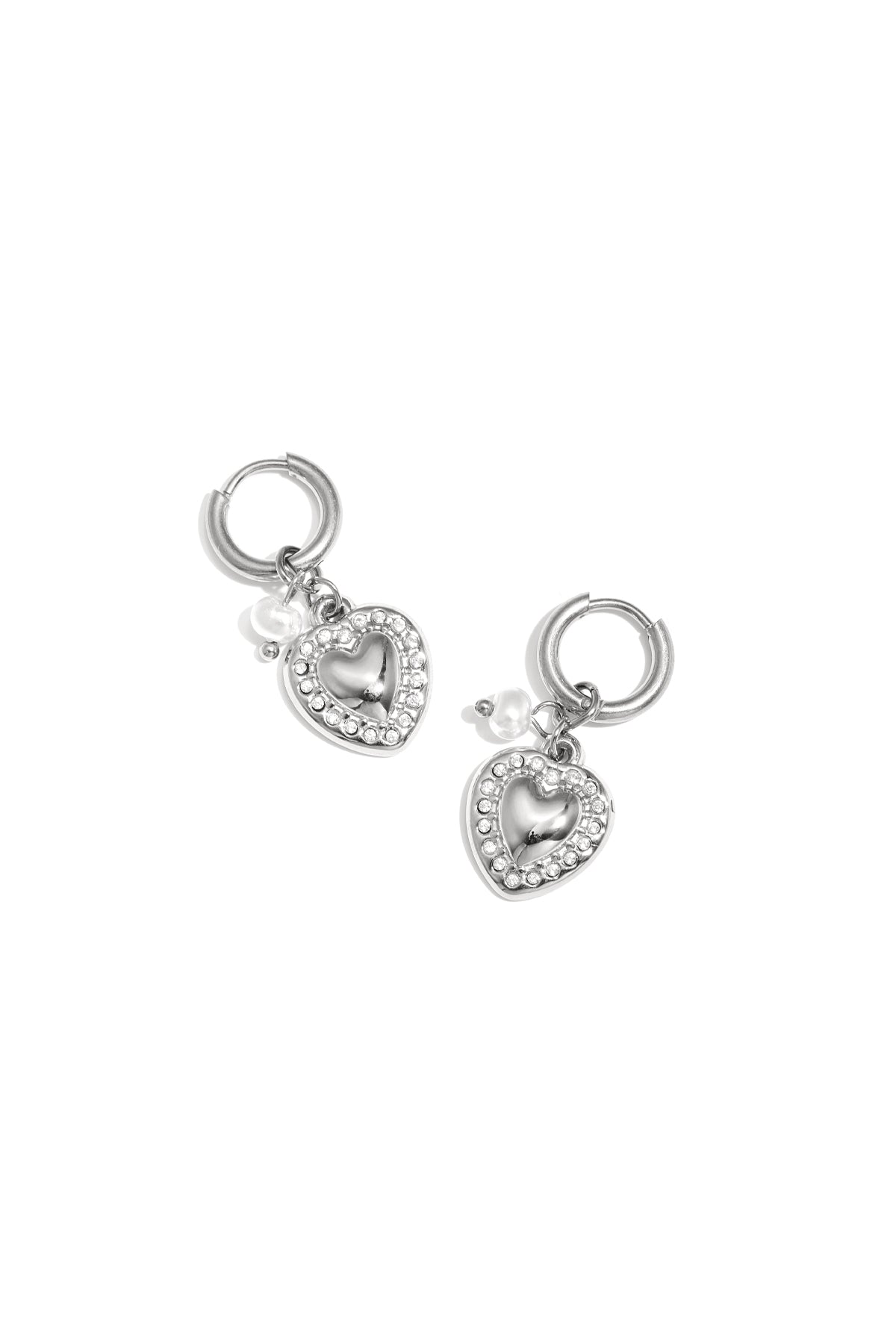 Silver heart drop earrings with rhinestone border and small pearl charm on white background
