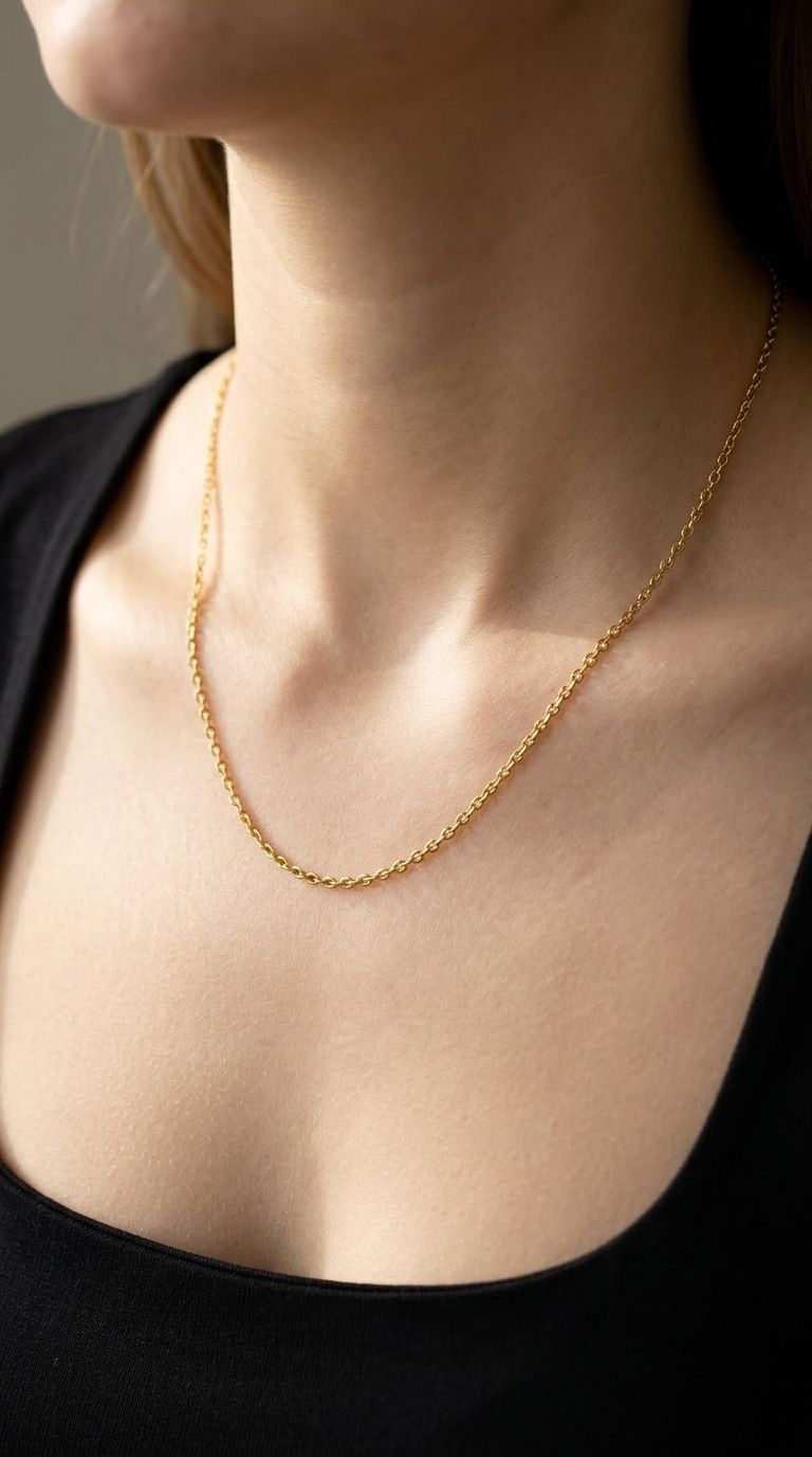Close-up of the 'Clean Gold Moment' stainless steel chain necklace highlighting its fine links and gold-tone finish.