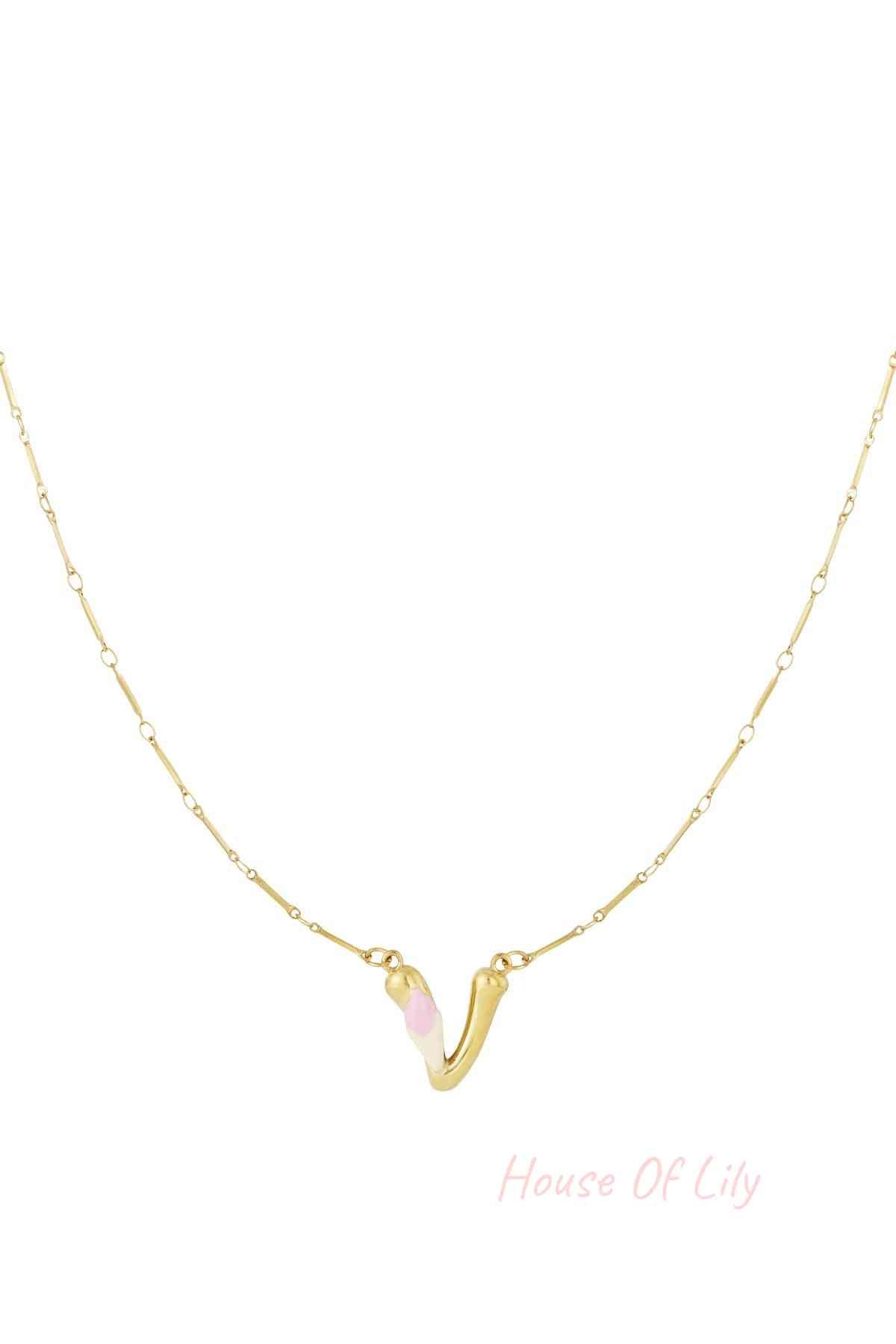 Gold necklace featuring a sculpted "V" initial pendant with white and light pink enamel accents on a slender gold chain.