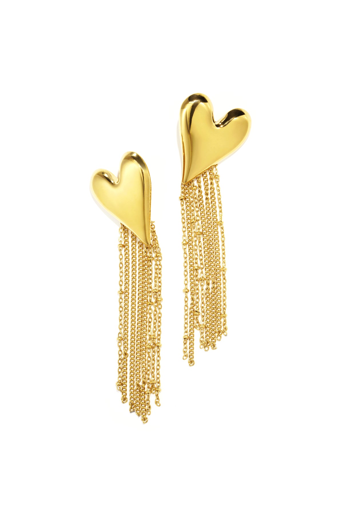 Close-up of golden heart-shaped dangle earrings with delicate chain tassels on white background